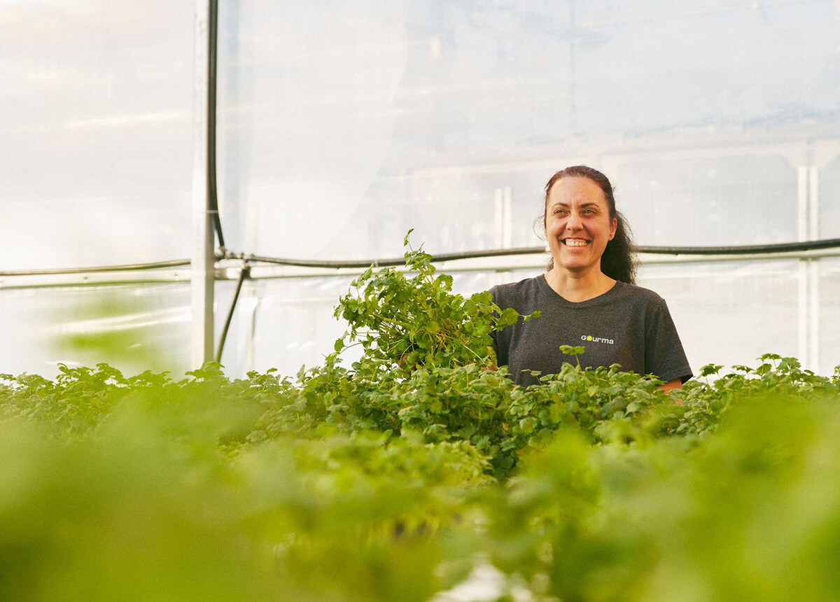 Woman working in a Gourma greenhouse